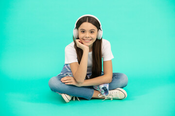 happy kid girl listen to music in wireless headphones, headset