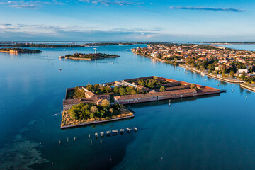 Fototapeta premium Flying over small Venice islands located in the middle of the Venetian lagoon. Beautiful aerial view of Venice.