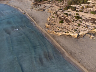Aerial view of blue sea waves and sand beach