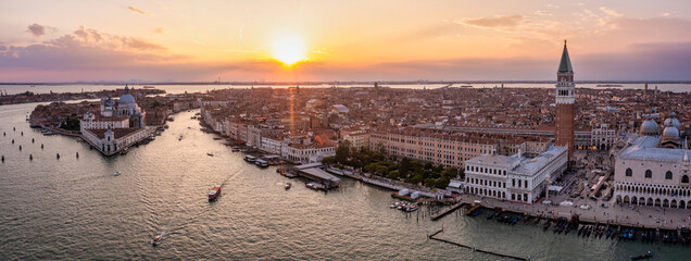 Magical evening sunset view over beautiful Venice in Italy. Aerial view of the Venice lagoon with a beautiful city view.