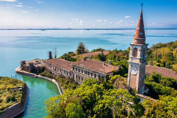 Aerial view of the plagued ghost island of Poveglia in the Venetian lagoon, opposite Malamocco...
