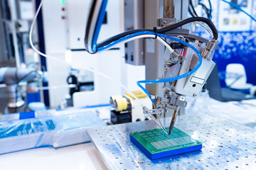 PCB production. Microboard blank inside soldering machine. Soldering equipment for manufacture of microcircuits. Soldering of elements microboards. PCB production in factory. Microboard production.