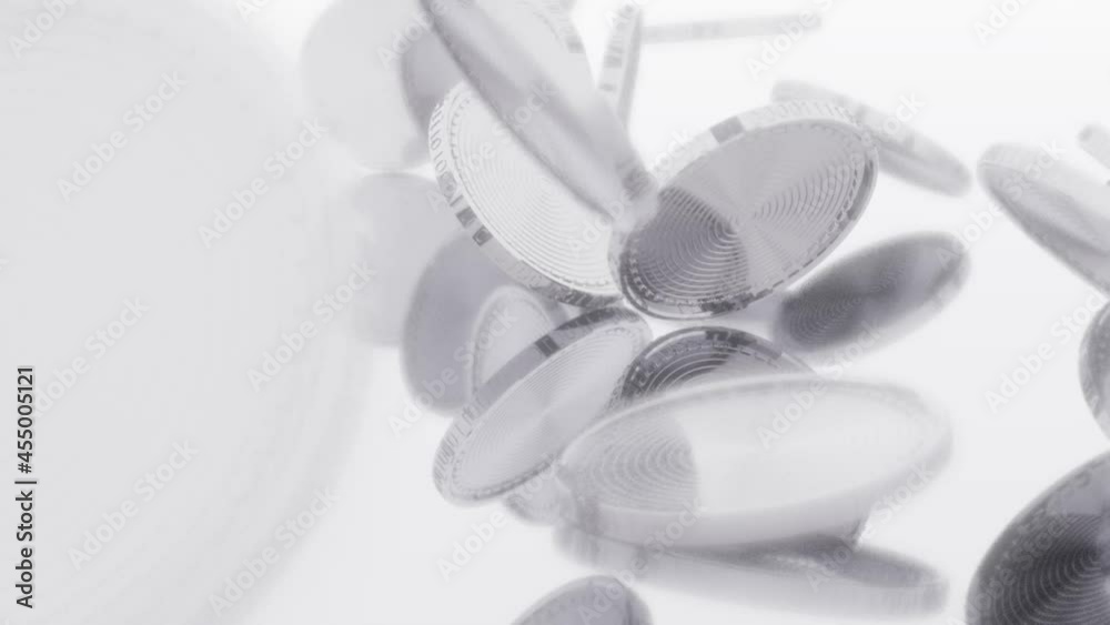 Poster blurred image of shiny metallic coins that fall from above and rotate on a white background. cryptoc