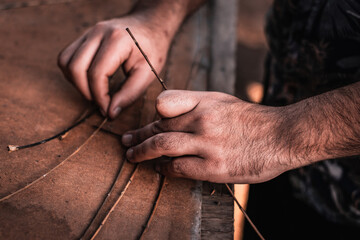 hands of a person working with fibers