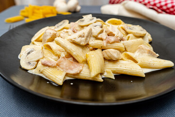 Pasta Penne with jam, Chicken and Mushroom under Parmesan Cheese