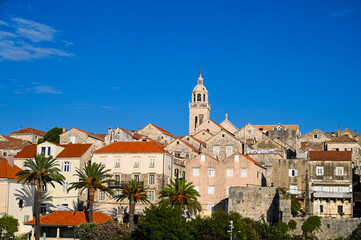 Old town Korcula on island Korcula, Dalmatia, Croatia. Beautiful historic town of Korčula at sunset. Medieval tower, walls, buildings and houses.