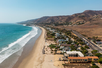 Luxury beachfront properties in Malibu, California, drone view - obrazy, fototapety, plakaty