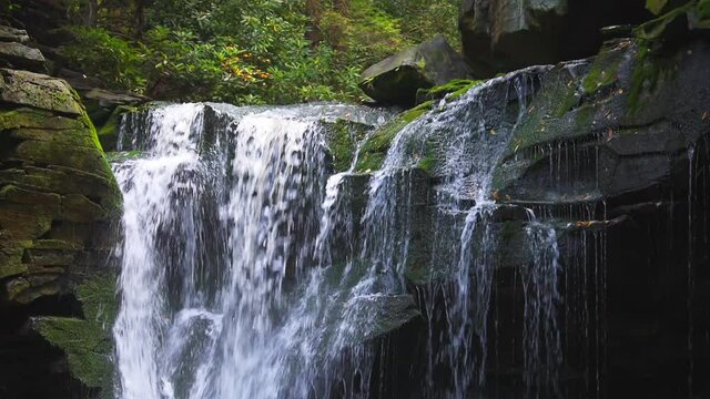 Blackwater Falls famous Elakala waterfall water flowing closeup in State Park in West Virginia during autumn fall season and rocks