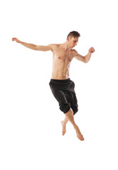 modern ballet dancer posing over white background