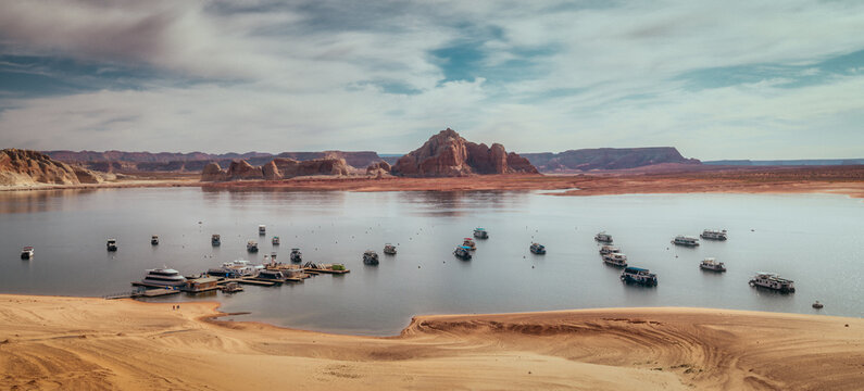 Panorama of boats on Lake Powell, Arizona with low water level