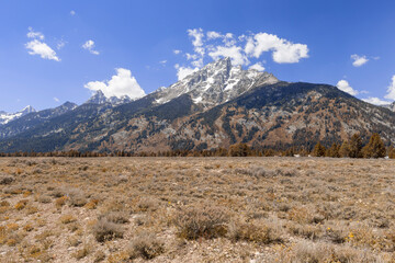 Photograph of a mountain range with snow on the peak in Wyoming