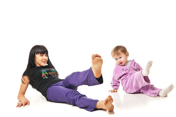 Fototapeta na wymiar Yoga for woman and child. Mother with the baby doing exercises