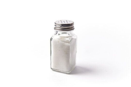 salt shaker isolatated on white, sodium container used for spice the food with a condiment with salty flavor
