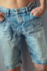 man dressed new aged denim shorts, closeup