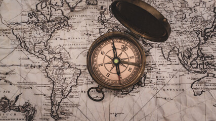 Obraz na płótnie Canvas Nautical Brass Compass On Map