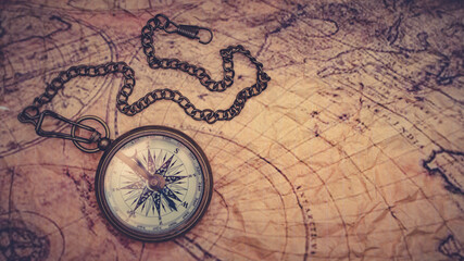 Fototapeta na wymiar old compass on map
