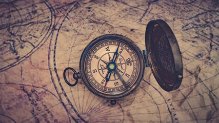 Fototapeta na wymiar Nautical Brass Compass On Map