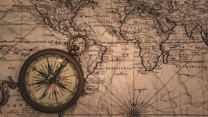 Naklejka na ściany i meble Nautical Brass Compass On Map