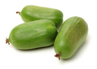 mini kiwi baby fruit (actinidia arguta) on white background 