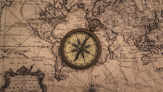 Nautical Brass Compass On Map