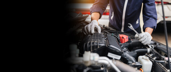 Automobile mechanic repairman hands repairing a car engine automotive workshop with a wrench, car service and maintenance,Repair service.