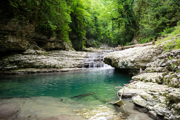 The Olginsky Waterfall in the Republic of Abkhazia. Cloudy day on May 21, 2021
