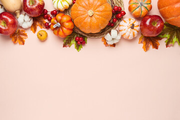 Thanksgiving holiday background with pumpkin, apples and fall leaves. Autumn season banner with copy space
