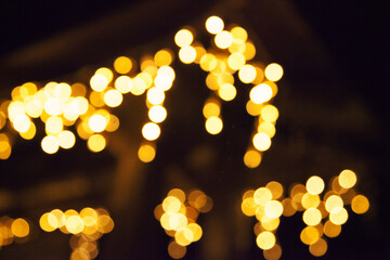  bokeh yellow and orange circles on a dark black background