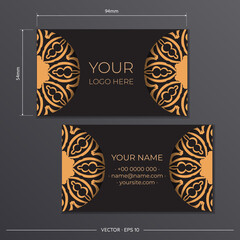 Business card preparation with Greek ornament. Black business card design with vintage patterns.