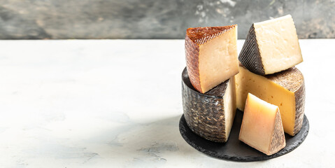 Petit Basque, French cheese, Cheese board of various types of soft and hard cheese. spanish...