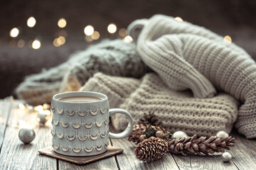 Cozy winter composition with a cup and decor details.