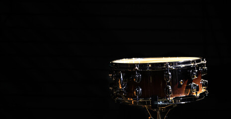 Snare drum on a black background, copy space.