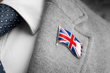 Metal badge with the flag of United Kingdom on a suit lapel