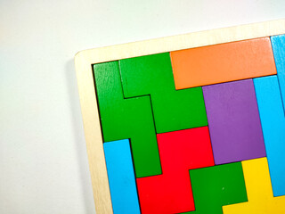 Colorful wooden Puzzle block on a white background.
