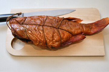 Wild Pacific sea bass (Latin Sebastes) or Pacific beak (Latin Sebastes alutus) hot smoked - Sea fish of the family Scorpaenidae 