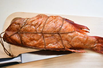 Wild Pacific sea bass (Latin Sebastes) or Pacific beak (Latin Sebastes alutus) hot smoked - Sea fish of the family Scorpaenidae 