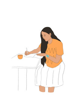Woman sitting at table and writing in notebook