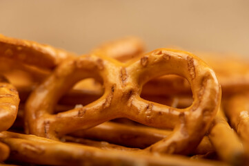 Crispy bread straws with salt, close-up, selective focus, top view.