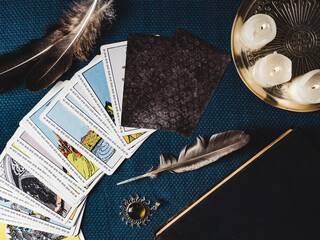 Tarot cards and esoteric concept. Magic rituals. Mystical table with details. View from above....