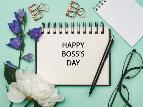Happy Boss Day. Notepad and stationery lying on the table. Close-up, view from above, no people. Congratulations for loved ones, relatives, friends and colleagues. Holiday concept