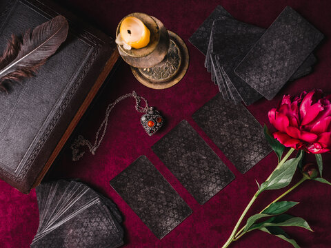 Tarot cards and esoteric concept. Magic rituals. Mystical table with details. View from above. Close-up