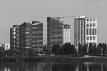Fototapeta premium Urban landscape at the lake in black and white