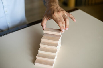 Manually organize the wood block stacking as a stepped staircase.