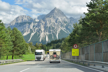 Holiday traffic in the Alps - obrazy, fototapety, plakaty