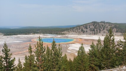 grand prismatic spring and mountains in yellowstone