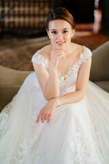 Fototapeta na wymiar beautiful and gentle bride in a white lace wedding dress. 