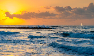 Fototapeta na wymiar Colorful sunset on the beach of the Mediterranean Sea