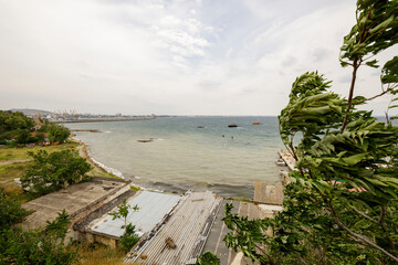 A sunken ship stranded off the coast. Black sea coast during strong winds.