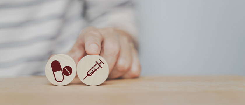 senior woman's hand choose injection icon instead of take medicine for alternative medical method, wellness, wellbeing , medical and health concept