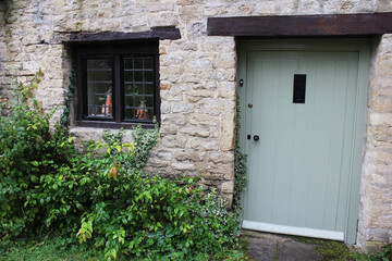 Fototapeta na wymiar Small house doors and bricks and windows